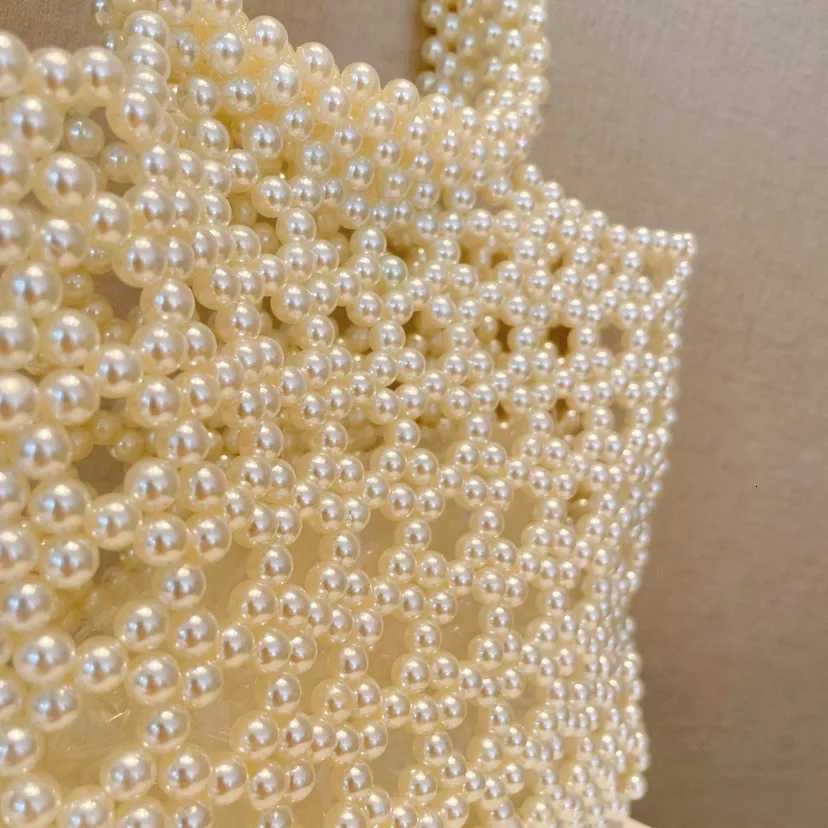 Fashion New Hollow Handmade Beaded Bag with Handheld pearl Bag for Wedding Party High quality Glittering Evening Bags Clutch bag H251027