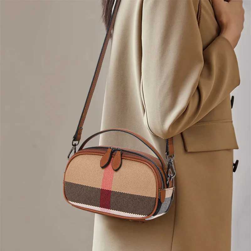 Crafted from canvas cowhide material Aidranis brown checkered round womens single shoulder crossbody bagT251028