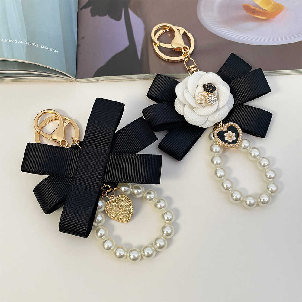 Highend Exquisite Korean Fashion Creative Camellia Ribbon Pearl Keychain Womens Bag Pendant Small Gift J251118