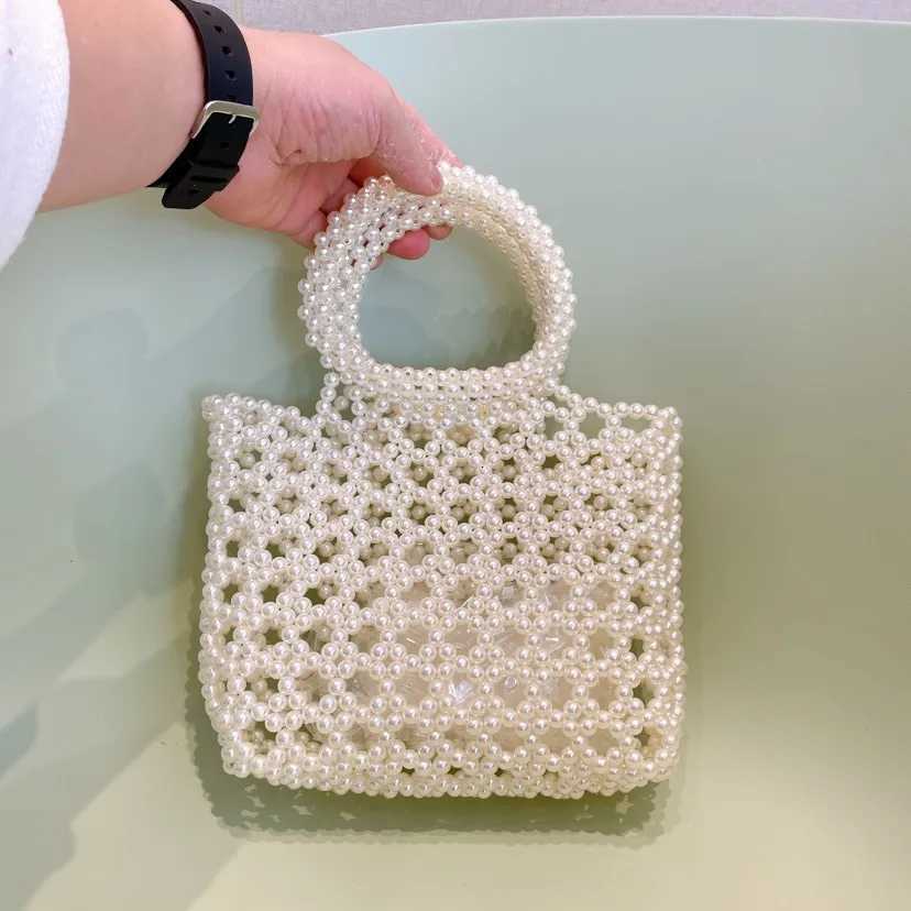 Fashion New Hollow Handmade Beaded Bag with Handheld pearl Bag for Wedding Party High quality Glittering Evening Bags Clutch bag H251027