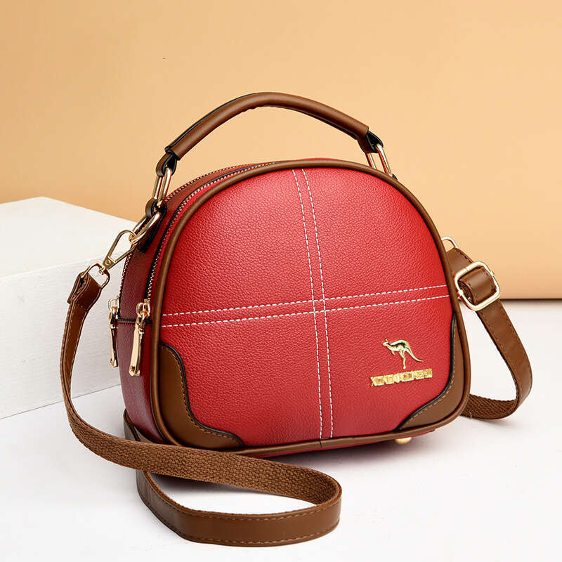 2025 New High-End Embroidered Crossbody Shoulder Women's Versatile Commuter Soft Leather Handbag Small Round Bag handbag for womens fashion bag