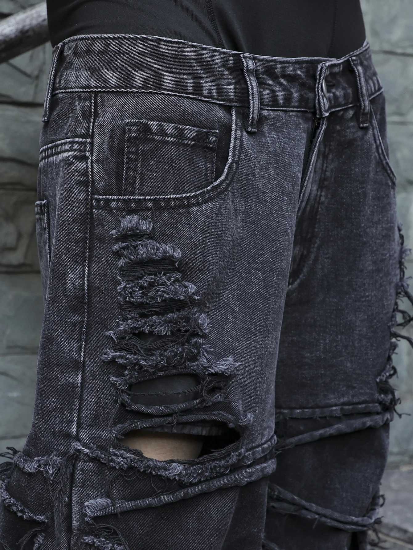 Mens black jeans With a design of ripped holes and tassels In a street trend style J2510301