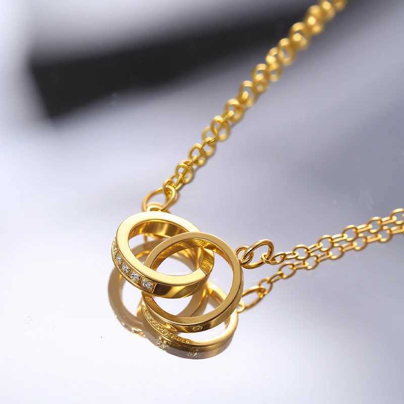 A necklace with two round rings connected by a clasp and set with zirconia stones engraved with the word loveXJ251030