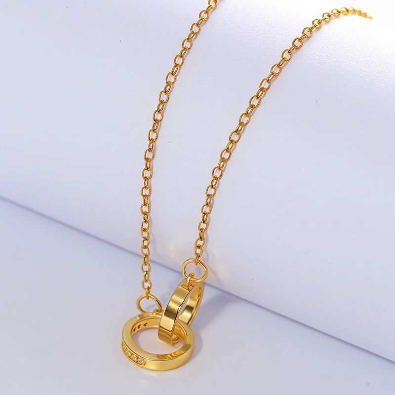 A necklace with two round rings connected by a clasp and set with zirconia stones engraved with the word loveXJ251030