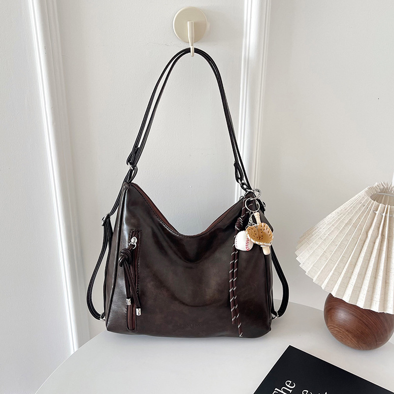 New retro commuting large capacity women's handbag, casual single shoulder cross body fashionable backpack, versatile and trendy designer bag