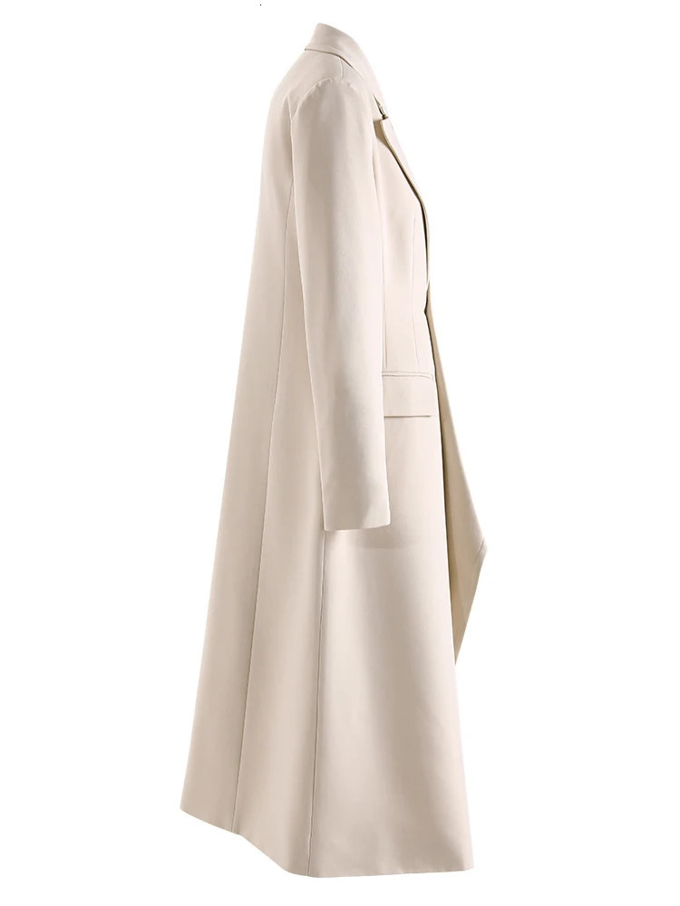 TWOTWINSTYLE Solid Spliced Pockets Irregular Trench For Women Lapel Long Sleeve Tunic Patchwork Button Temperament Coats Female 251029