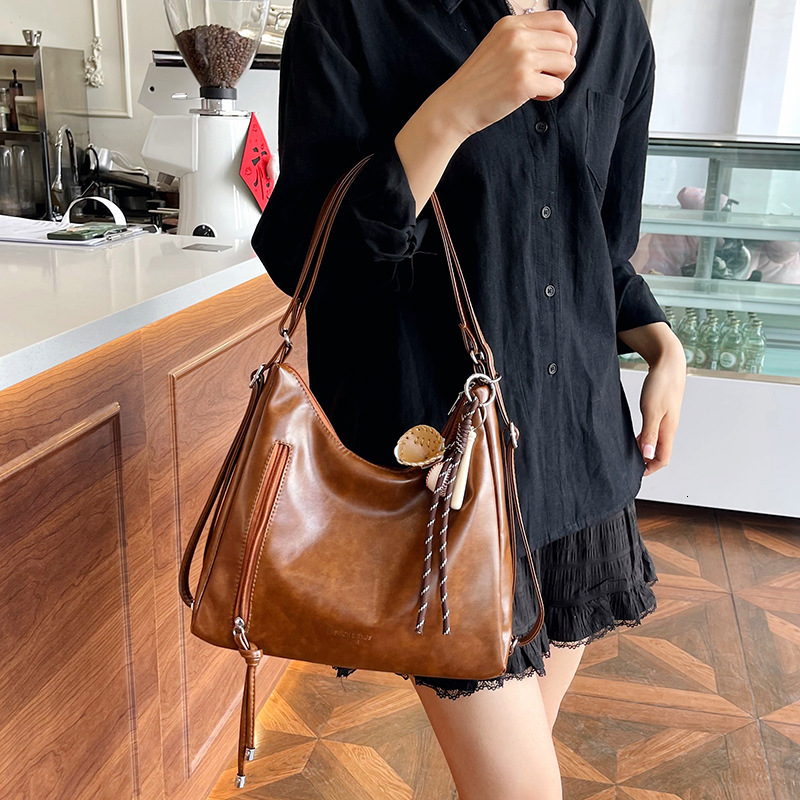 New retro commuting large capacity women's handbag, casual single shoulder cross body fashionable backpack, versatile and trendy designer bag