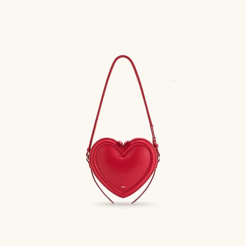 Womens commuter heartshaped crossbody bag niche design threedimensional heart genuine leather singleshoulder crossbody bagW251031