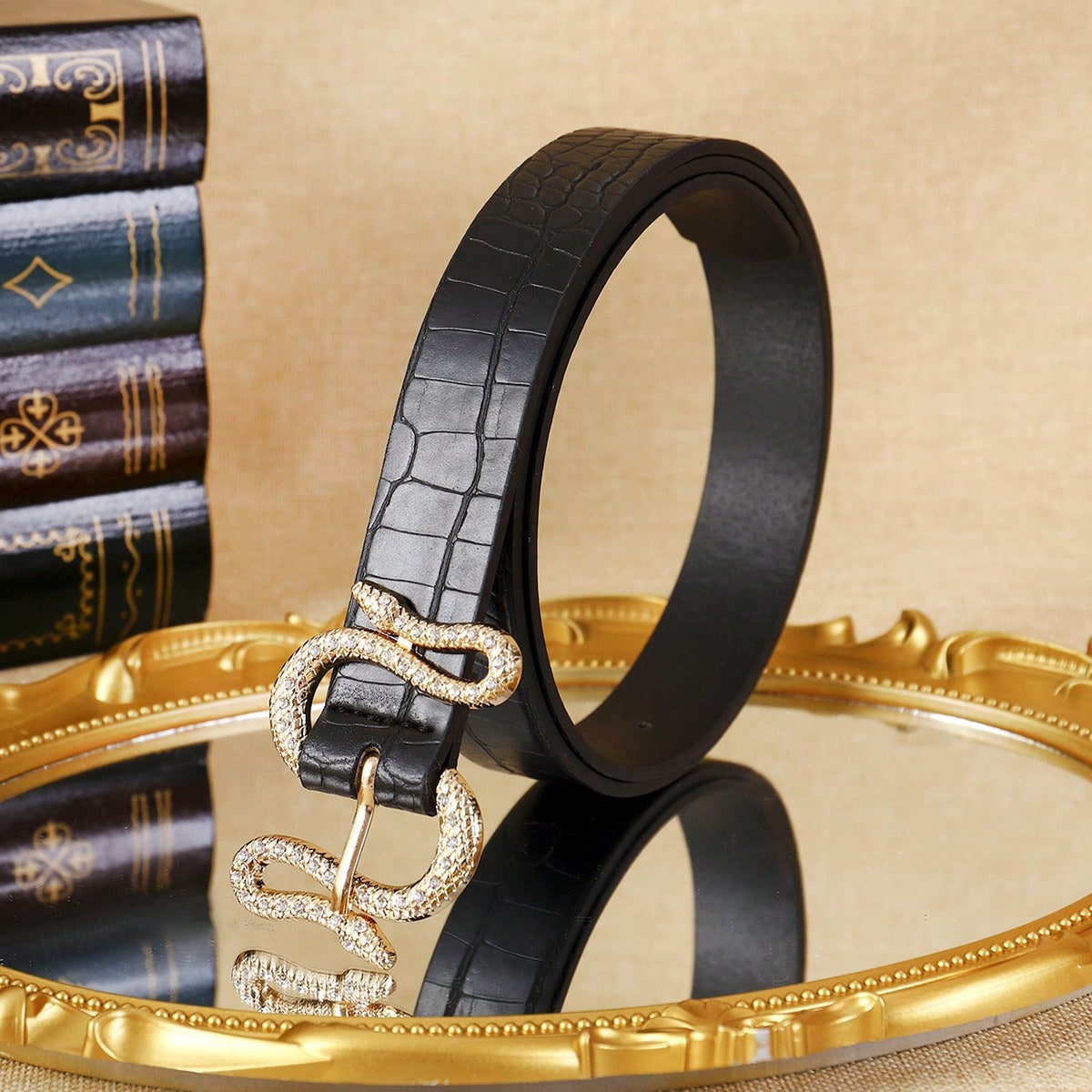 A black PU point-diamond crocodile-patterned waist belt is a trendy fashion accessory for casual and sporty wear. It is suitable for daily use.