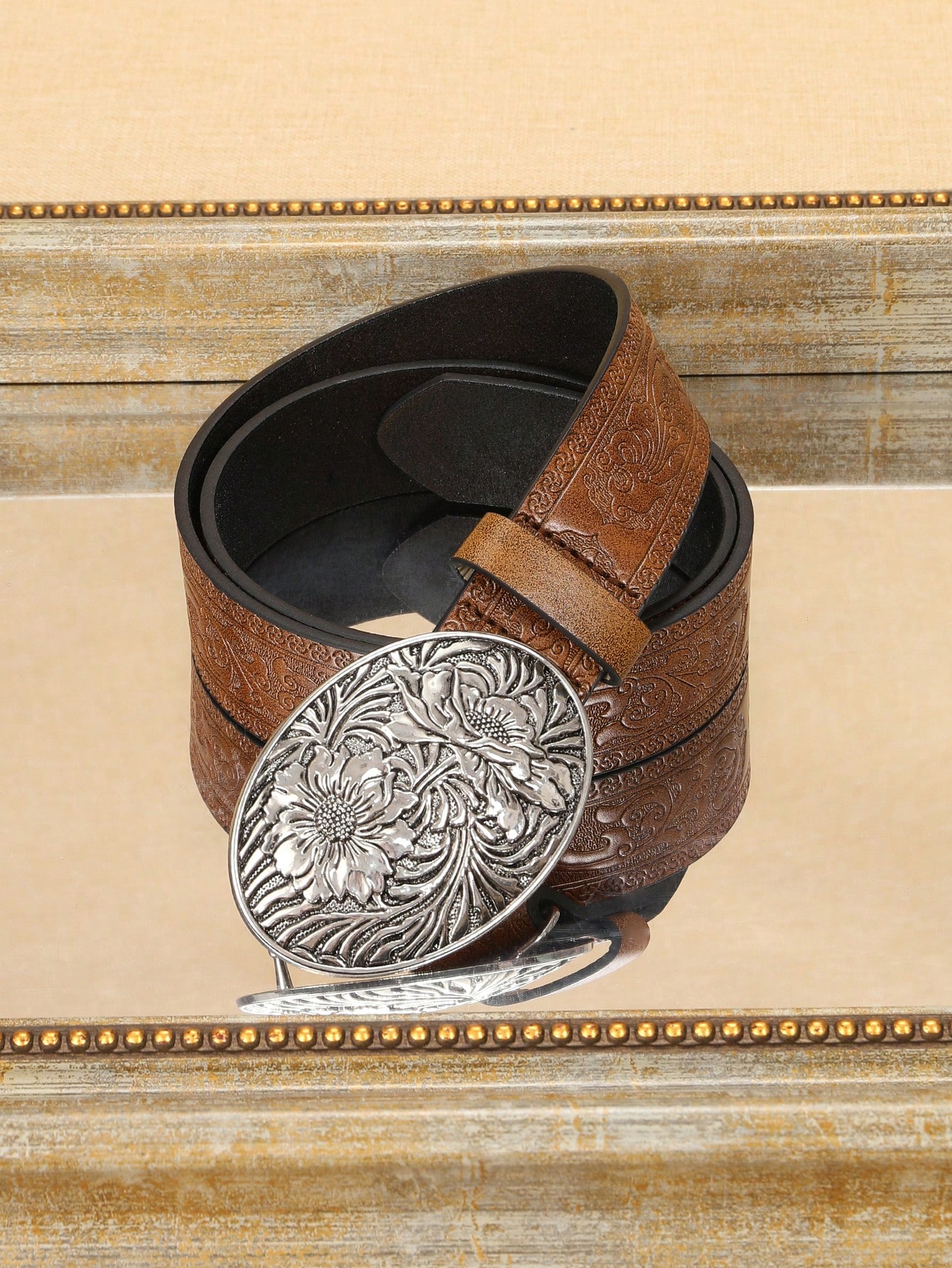 A ladies' polyurethane coffee-colored belt. This is a stylish and trendy Bohemian-style leather belt accessory that is suitable for streetwear co