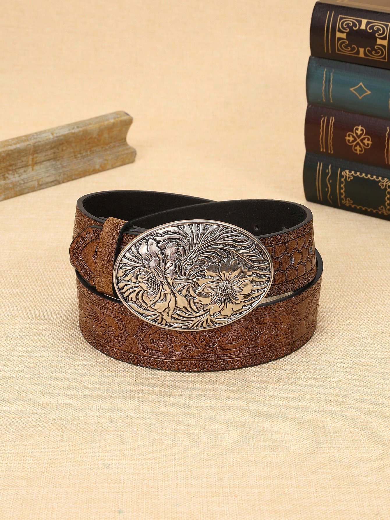 A ladies' polyurethane coffee-colored belt. This is a stylish and trendy Bohemian-style leather belt accessory that is suitable for streetwear co