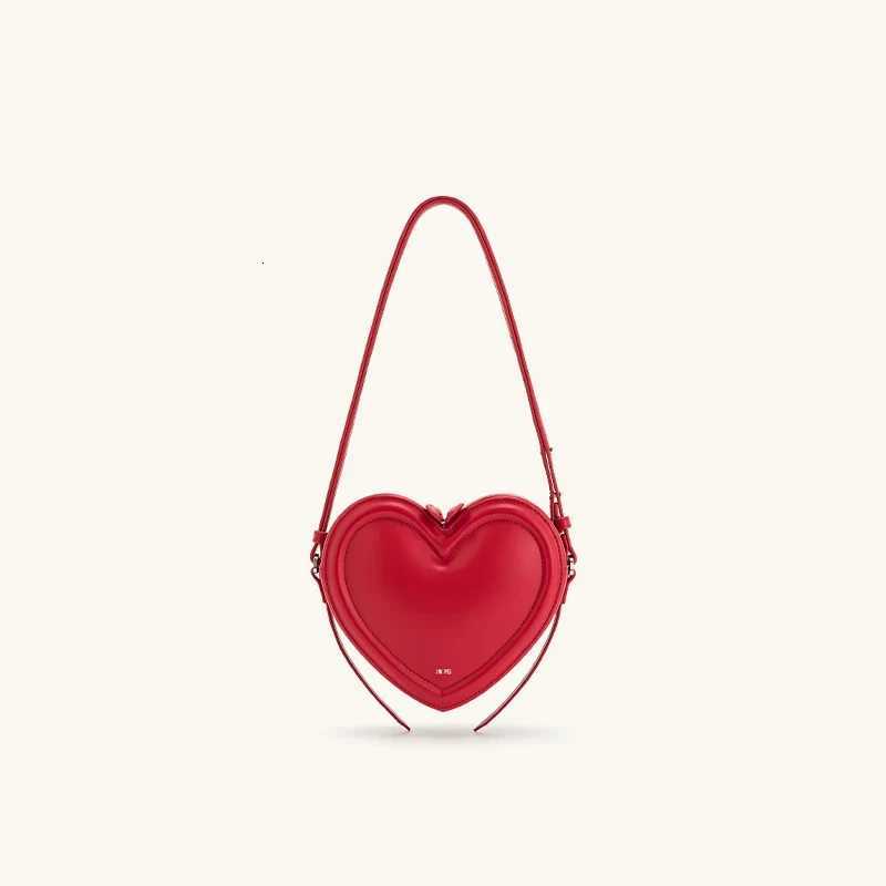 Womens commuter heartshaped crossbody bag niche design threedimensional heart genuine leather singleshoulder crossbody bagW251031