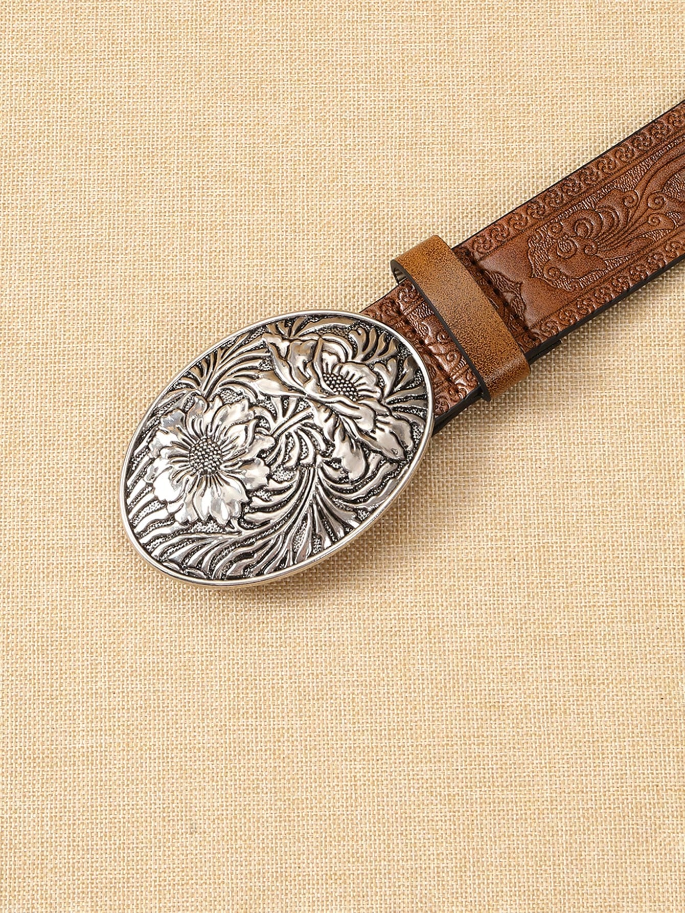 A ladies' polyurethane coffee-colored belt. This is a stylish and trendy Bohemian-style leather belt accessory that is suitable for streetwear co