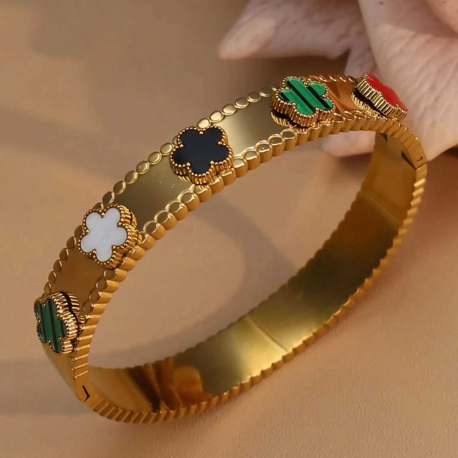 Sophisticated Ladies' Wristwear Collection Featuring Unique Acrylic Flowers Attached to Robust Metallic Arm Bands