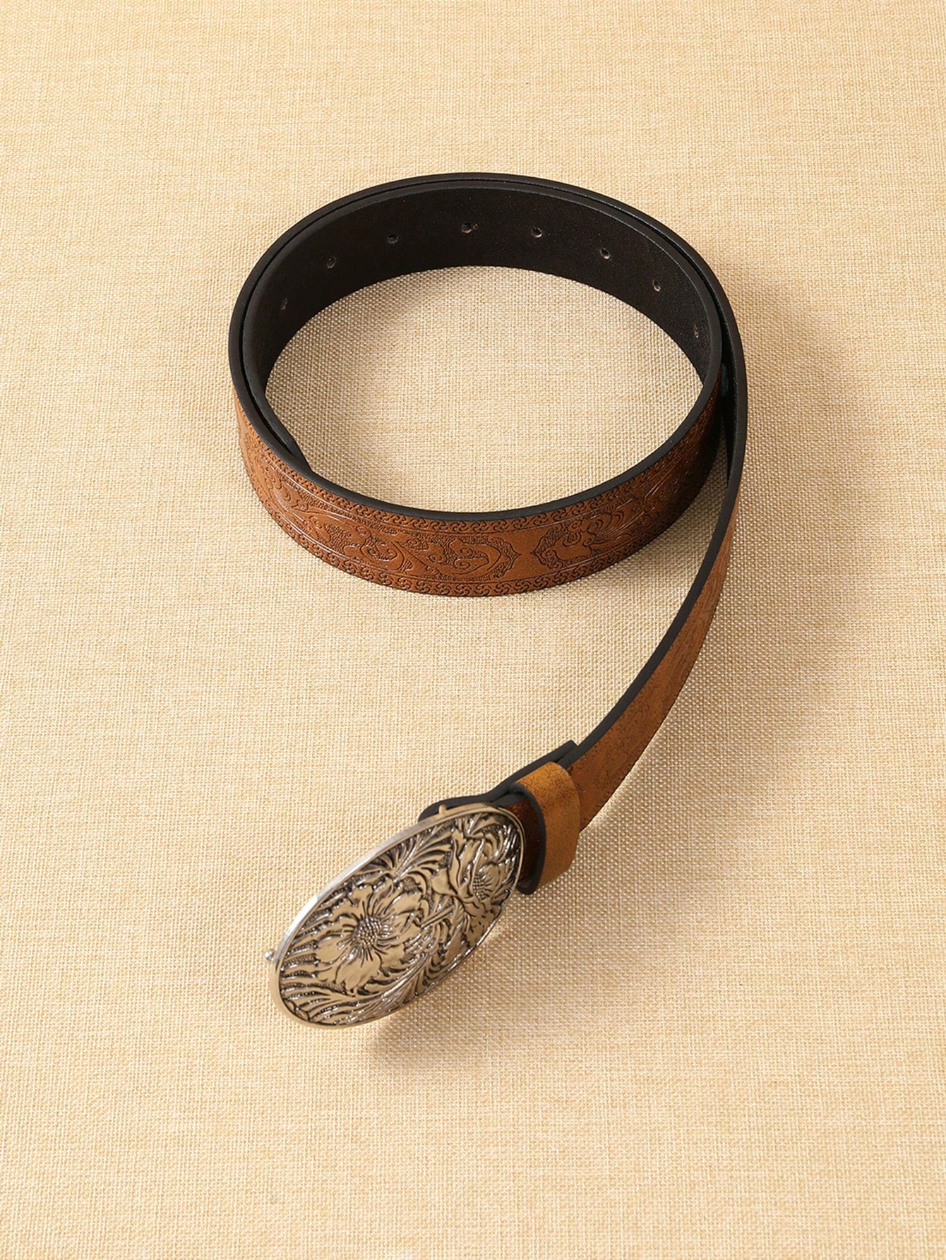 A ladies' polyurethane coffee-colored belt. This is a stylish and trendy Bohemian-style leather belt accessory that is suitable for streetwear co