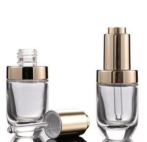 Venta de fábrica Botella cuentagotas de perfume de aceite esencial cosmético de 30 ml 30 ml con tapa de bomba de prensa dorada
