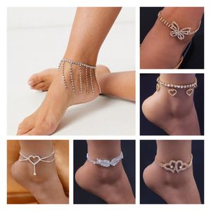 Tobilleras de cadena con colgante de corazón y borla ostentosa a la moda, pulsera de tobillo con alas de ángel y mariposa para mujer, joyería de playa con diamantes de imitación brillantes sexys bohemios