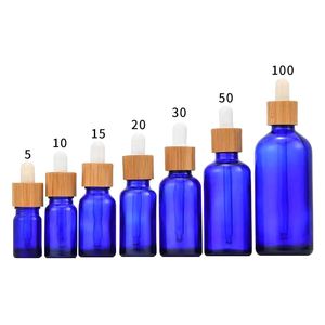 Flacon compte-gouttes en verre bleu givré 5 ml 10 ml 15 ml 30 ml 50 ml avec couvercle en bambou 1 oz bouteilles d'huile essentielle de bambou