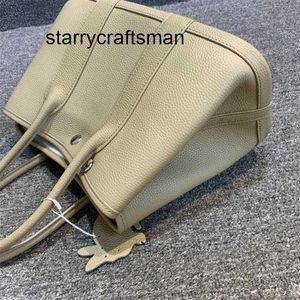 Sac de jardin en cuir véritable Shopping produits de retrait en cuir véritable version coréenne mode polyvalente une épaule simple L avec logo