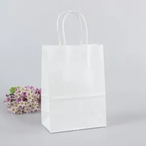 Cadeau cadeau 10pcs / lot simple sac de papier de couleur blanche festival avec poignées sacs en tissu à la mode excellente qualité 27 21 11cm