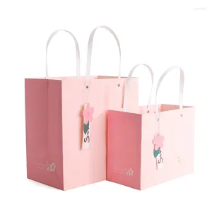 Enveloppe cadeau 500pcs / lot en gros logo personnalisé Sac en papier rose magasin de vêtements durable boutique d'achat d'achat d'achat