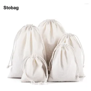 Reportaje de regalos Stobag 50pcs bolsas de algodón al por mayor Drawstring Joya pequeña Embalaje de caramelo Almacenamiento de tela de tela de bolsillo reutilizable