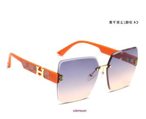 H home Top Gafas de sol originales al por mayor a la venta 2023 New Tiktok Fans Live Fashion Trend Net Gafas de sol sin marco rojas con caja de regalo Con caja de regalo RO69