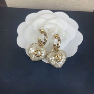 boucles d'oreilles coeur d'amour de luxe de haute qualité goujons pour femmes filles charme en or 18 carats blanc noir élégant boucles d'oreilles design OL boucles d'oreilles boucles d'oreilles bijoux