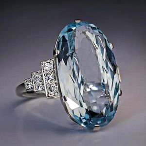 Huitan-Anillo de boda azul cielo claro para mujer, banda solitaria, piedra ovalada, fiesta de compromiso, joyería de lujo, piedra brillante CZ, el mejor regalo