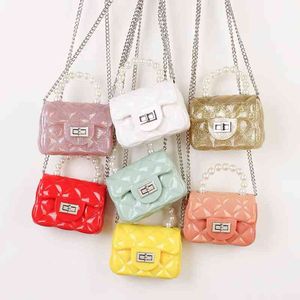 INS Hotsale Pearl Handle Candy Color Jelly Bolsos Precio barato Mini Bolsos de mujer Lindo PVC Glitter Ladi Bolsas