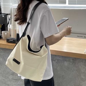 Japon Corée du Sud nouveau sac à bandoulière femmes Instagram mode sac en toile décontracté simple et tendance grande capacité sac mère et enfant marée 240315