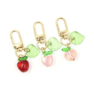 Porte-clés en gros femmes filles fruits pendentif porte-clés acrylique pomme pêche fermeture éclair pl charme planificateur charmes accessoires hangbag suspendu dhhbs