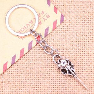 Porte-clés 20pcs mode porte-clés 41x12mm squelette oiseau poignard pendentifs bricolage hommes bijoux voiture porte-clés porte-anneau souvenir pour cadeau