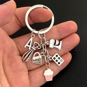Keychains Lonyards AZ Lesert Dessert Keychain Baking Key Ring Cake Ever Beater Blender Mesury Cup Moules Moules pour le chef Gift Jewelry 230831