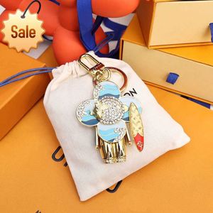 Keychains Lanyards Designer Keychain Sunflower Kelechains Car Charm Fun Hundred Match Sac Couple mignon Panda Godlug