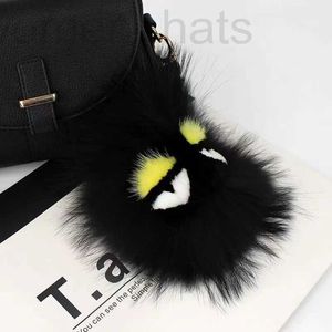 Porte-clés Longes Designer Luxe Fluffy Karl Véritable Fourrure De Raton Laveur Pompon Monster Bag Bugs rm Keyin Peluche Porte-clés En Cuir Gland DI D95M