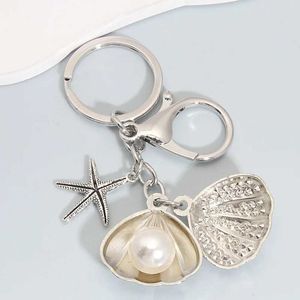 Keychains Lanyards Fashion Pearl Starfish Shell Alloy Keychain Silver Color SEA Key Chains pour fabriquer des accessoires de bijoux de bricolage faits à la main Résultats Q240403