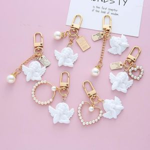 Llaveros Vintage llavero de ángel blanco para mujeres niñas Mini colgante de corazón de perla con llavero estuche para auriculares encantos joyería