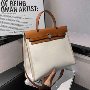 Version coréenne du petit sac à main japonais en toile contrastée de grande capacité pour femme, sac à bandoulière à la mode, vente directe d'usine à la mode à 75 %
