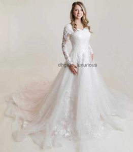 Lace Applique en tulle modestes robes de mariée en ligne A avec manches longues en décolleté en cœur arrière Country Western Bridal Robes