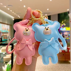 Llaveros de oso de cuero Accesorios para mujer Llaveros de diamantes de imitación de moda Correa de PU Arco Llaveros de coche Fobs Colgante de color caramelo Bolsa de joyería Encantos Llaveros de animales Titular