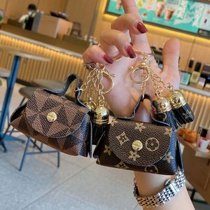 Llaveros de cuero Anillos Joyería Flor marrón A cuadros Borla Monedero Llaveros Colgante Moda Mini Bolsa de almacenamiento Encanto Llaveros Accesorios 2024