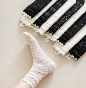 Lolita Ruffle Chaussettes hautes à la cheville Bubble Chunky Slouch JK Uniform Scrunch Bas Mid-Tube Japonais Anime Cosplay Porter des sous-vêtements féminins noirs et blancs