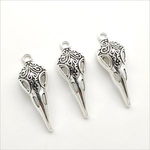 Lote 100 unids Bird Skull Tibetan Silver Charms Beads Colgantes para la fabricación de joyas Pendiente Collar Pulsera Llavero accesorios 35 * 13 mm DH0379