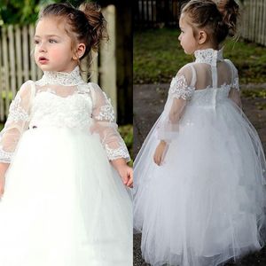 Encantadores vestidos de niña de flores de manga larga con cuello alto 2018 para bodas Apliques de encaje Princesa Cumpleaños Vestido de primera comunión blanco EN2058