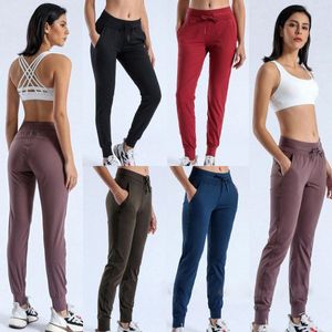 Tissu Naked-feel Workout Sport Joggers Pantalon court Femme Taille Cordon Fitness Running Pantalon de survêtement avec deux poches latérales