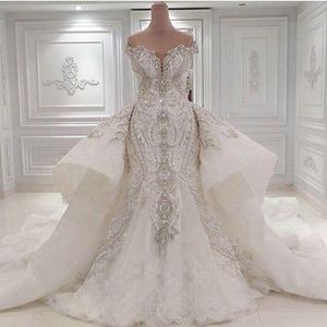 Vestidos de novia de sirena de encaje de imagen real de lujo 2020 con sobrefalda desmontable Dubai Retrato árabe Cristales brillantes Diamantes Vestidos de novia