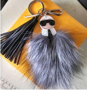 Logo de luxe Fluffy Karl Véritable Raccon Fourrure Pompom Monster Sac Bugs Bugs Porte-clés Peluche Peluche Bague Cuir Tassel Pompon