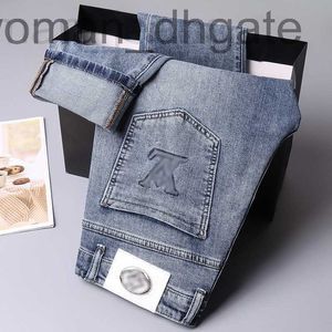 Jeans pour hommes Designer Designer Marque de mode jeans imprimés brodés pour le printemps des hommes nouvelle tendance coupe slim petit pantalon de jambe mode KGQO CQ9M