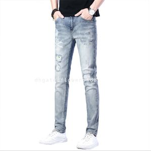 Jeans masculin Hot Diamond Light Color Slim Beau étirement usé Personnalité du crâne Nouveau jean Jean bleu Femmes Blue Purple Jeans Blue Ripped Jeans QP